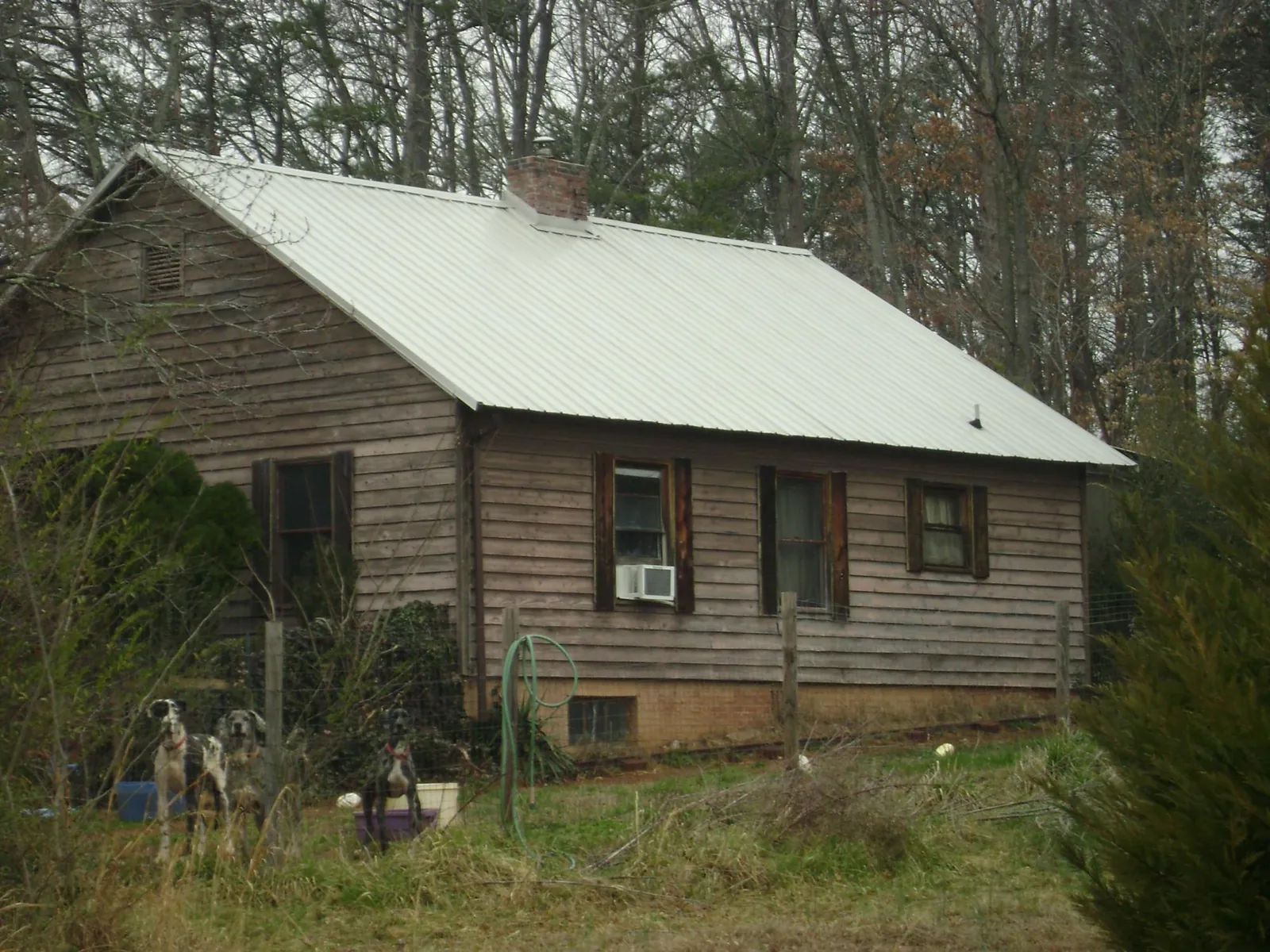 White metal roof on an old wood sided farmhouse, from a Metal Roof Installation job in Antimony